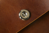 Brown vegetable tanned leather cell phone belt pouch