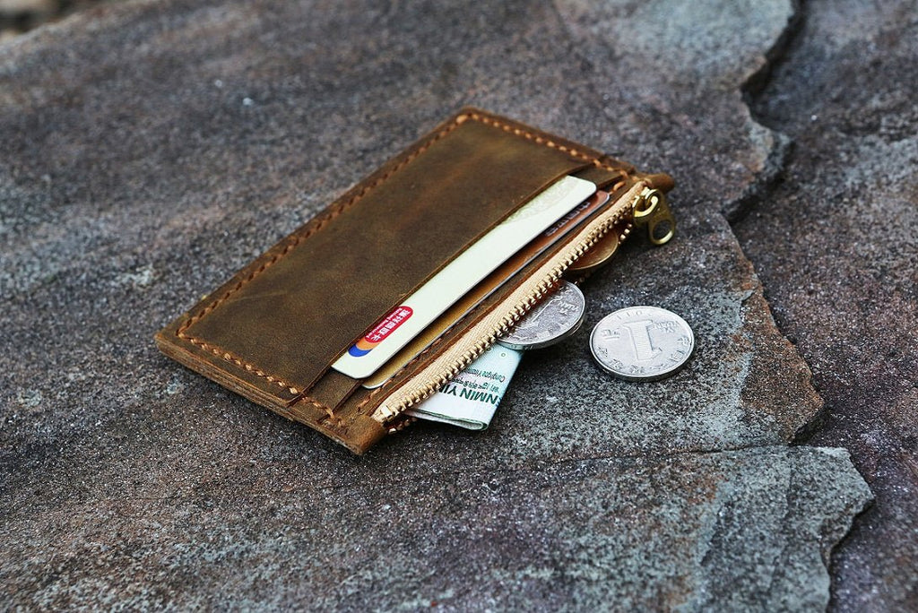 Best minimalist leather wallet! Cash, coins and cards. Unique design.  Practical! 