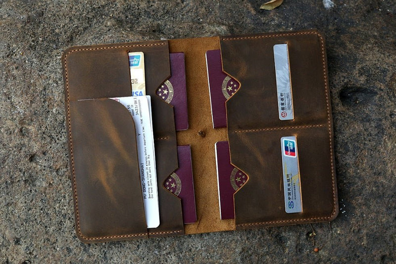 https://dmleatherstudio.com/cdn/shop/products/personalized-distressed-leather-family-4-passport-holder-case-organizer-wallet-995252_800x.jpg?v=1696127708
